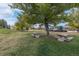 Scenic community area with mature trees and picnic tables for outdoor gathering and relaxation at 2290 S Braun Way, Lakewood, CO 80228