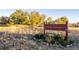 Well-maintained trail entrance with colorful Ute Trail Gardens sign and landscaping in a park setting at 2290 S Braun Way, Lakewood, CO 80228