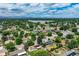 Expansive aerial view showcasing the neighborhood, nearby lake, and stunning mountain views at 7936 Eaton St, Arvada, CO 80003