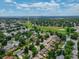 Aerial view showcasing the community, green space, and a vibrant neighborhood at 7936 Eaton St, Arvada, CO 80003
