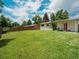Expansive, fenced backyard with lush grass, offering ample space for recreation at 7936 Eaton St, Arvada, CO 80003