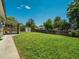 Well-maintained, fenced backyard with lush lawn and convenient storage shed at 7936 Eaton St, Arvada, CO 80003