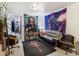 Finished basement showcasing ample living space, wood-look flooring, and unique decor at 7936 Eaton St, Arvada, CO 80003