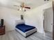 Spacious bedroom featuring a ceiling fan, and hardwood floors at 7936 Eaton St, Arvada, CO 80003