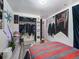 Bedroom featuring wood-look flooring, a bed, and eclectic decor at 7936 Eaton St, Arvada, CO 80003