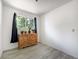 Bright bedroom featuring wood-look floors, and natural light at 7936 Eaton St, Arvada, CO 80003