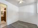 Bright bedroom featuring wood-look flooring and neutral walls at 7936 Eaton St, Arvada, CO 80003