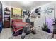 Bedroom featuring wood-look flooring, a bed, and eclectic decor at 7936 Eaton St, Arvada, CO 80003