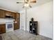 Bright kitchen featuring tile flooring, oak cabinets, and white appliances at 7936 Eaton St, Arvada, CO 80003