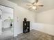 View of eat-in kitchen with tile floor, ceiling fan and black shelving unit at 7936 Eaton St, Arvada, CO 80003