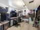 View of a music studio with multiple monitors, soundproofing, and musical instruments at 7936 Eaton St, Arvada, CO 80003