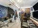 View of a music studio with multiple monitors, soundproofing, and musical instruments at 7936 Eaton St, Arvada, CO 80003