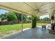 Covered patio with ceiling fan overlooking a spacious, fenced backyard at 7936 Eaton St, Arvada, CO 80003