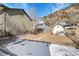 Backyard showcasing the home's setting against a mountain backdrop and neighborhood views at 1918 Virginia St, Idaho Springs, CO 80452