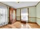 Cozy bedroom with hardwood floors, antique armoire, and natural light at 1918 Virginia St, Idaho Springs, CO 80452