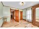 Charming bedroom with hardwood floors, ornate trim, and vintage details at 1918 Virginia St, Idaho Springs, CO 80452