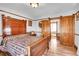 Bedroom with wood bed, quilt, and vintage wood dresser at 1918 Virginia St, Idaho Springs, CO 80452