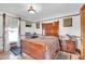 Vintage bedroom with wood furnishings, patterned quilt, and natural light from the windows at 1918 Virginia St, Idaho Springs, CO 80452