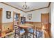 Traditional dining room with hardwood floors, chandelier, and wood trim at 1918 Virginia St, Idaho Springs, CO 80452