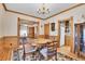 Dining room with a round wooden table, chandelier and hardwood floors at 1918 Virginia St, Idaho Springs, CO 80452