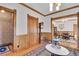 Hallway with hardwood floors, wood trim, and classic decor, connecting multiple rooms at 1918 Virginia St, Idaho Springs, CO 80452