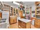 Bright kitchen with wood cabinets, an island, and stainless steel appliances at 1918 Virginia St, Idaho Springs, CO 80452