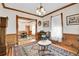 Elegant living room featuring hardwood floors, classic trim, and an antique rug at 1918 Virginia St, Idaho Springs, CO 80452