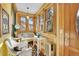 Cozy sun room featuring wood paneled walls, wicker furniture, and lots of natural light at 1918 Virginia St, Idaho Springs, CO 80452