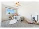 Cozy bedroom with a plush rug, and a large window for natural light at 5207 S Jericho Way, Centennial, CO 80015