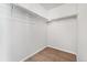 Empty walk-in closet with hardwood floor and shelving at 5207 S Jericho Way, Centennial, CO 80015