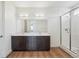 Modern bathroom with double vanity, large mirror and glass-enclosed shower at 6384 E 154Th Pl, Thornton, CO 80602