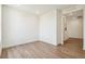 An empty bedroom with wood-style flooring, white walls and ample natural light at 6384 E 154Th Pl, Thornton, CO 80602