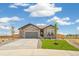 Well-maintained one story home featuring stone exterior and manicured front yard at 6384 E 154Th Pl, Thornton, CO 80602