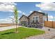 Beautiful single Gathering home displaying manicured lawn and stone exterior at 6384 E 154Th Pl, Thornton, CO 80602