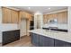 Bright kitchen showcases a large island, walk-in pantry and stainless appliances at 6384 E 154Th Pl, Thornton, CO 80602