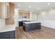 Bright kitchen boasts a spacious island, stainless appliances and modern cabinetry at 6384 E 154Th Pl, Thornton, CO 80602