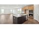 Bright kitchen showcases a large island with sink and stainless appliances at 6384 E 154Th Pl, Thornton, CO 80602