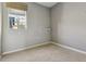 Simple bedroom with neutral carpet and walls and a window with blinds at 1622 W 67Th Ave, Denver, CO 80221