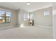 Bright and airy bedroom with neutral carpet, multiple windows and ample space for furnishings at 1622 W 67Th Ave, Denver, CO 80221