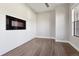 Modern bedroom with hardwood floors, shiplap accent wall, and a unique recessed wall feature at 1622 W 67Th Ave, Denver, CO 80221