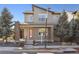 Charming two-story home with modern architecture, red front door, and landscaped front yard at 1622 W 67Th Ave, Denver, CO 80221