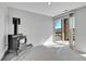 Bright living room featuring a wood-burning stove and sliding doors to the outside at 7511 S Sicily Way, Aurora, CO 80016