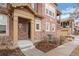 Inviting front porch with brick accents and well-maintained landscaping at 9599 Cedarhurst Ln # A, Highlands Ranch, CO 80129