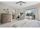 Bright main bedroom with balcony access, and an ensuite bathroom at 9599 Cedarhurst Ln # A, Highlands Ranch, CO 80129