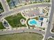 Aerial view highlighting community features, a pool and a park at 18875 W 93Rd Ave, Arvada, CO 80007