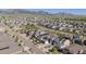 Scenic aerial view of a well-planned residential community with tree-lined streets against a mountain backdrop at 18875 W 93Rd Ave, Arvada, CO 80007