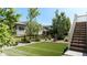 Well-maintained backyard featuring artificial turf, a stained wood fence, and low-maintenance landscaping at 18875 W 93Rd Ave, Arvada, CO 80007