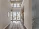 Bright two-story foyer with hardwood floors, large windows, and modern finishes at 18875 W 93Rd Ave, Arvada, CO 80007