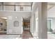 Spacious foyer featuring wood floors, tall ceilings, and views to the kitchen at 18875 W 93Rd Ave, Arvada, CO 80007