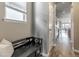 Entry hallway featuring wood floors, and access to living areas and kitchen at 18875 W 93Rd Ave, Arvada, CO 80007